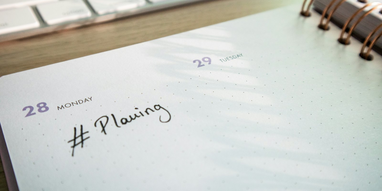 An open planner on a desk